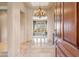 Inviting foyer featuring tile flooring, a chandelier, and an entryway to the living room at 37170 N Granite Creek Ln, Carefree, AZ 85377