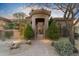Beautiful front entry with custom gate, mature trees and a brick pathway at 37170 N Granite Creek Ln, Carefree, AZ 85377