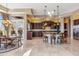 Expansive kitchen featuring a large island, modern appliances, and an adjacent dining area at 37170 N Granite Creek Ln, Carefree, AZ 85377