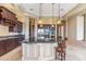 Gourmet kitchen island with seating and view of stainless steel appliances at 37170 N Granite Creek Ln, Carefree, AZ 85377