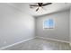 Bedroom with ceiling fan, desert view, hard flooring and neutral paint at 40715 W Georgia Ave, Tonopah, AZ 85354