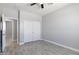 This is a bedroom with gray colored walls and tile floors, including a closet at 40715 W Georgia Ave, Tonopah, AZ 85354
