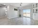 Spacious dining room with tile flooring, chandelier, and sliding glass doors to the backyard at 40715 W Georgia Ave, Tonopah, AZ 85354