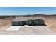 An aerial view of a charming home with a covered entryway, a convenient garage, and picturesque desert views at 40715 W Georgia Ave, Tonopah, AZ 85354