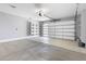 Spacious garage with shelving, automatic garage door, and space for two cars at 40715 W Georgia Ave, Tonopah, AZ 85354