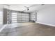 Spacious garage with shelving, garage door with windows, and space for two cars at 40715 W Georgia Ave, Tonopah, AZ 85354