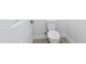 Toilet in white modern bathroom with tile flooring and fresh paint at 40715 W Georgia Ave, Tonopah, AZ 85354