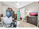 Cozy room featuring neutral colors, a ceiling fan, a TV, and eclectic decorations at 41229 N Belfair Way, Anthem, AZ 85086