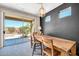 View of dining area leading to outdoor space through sliding glass doors; showcasing natural light at 41229 N Belfair Way, Anthem, AZ 85086