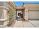 Inviting front entrance with desert landscaping and a covered walkway at 41229 N Belfair Way, Anthem, AZ 85086