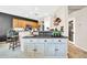 Open-concept kitchen showcasing granite countertops, stainless steel appliances, and eat-in breakfast bar at 41229 N Belfair Way, Anthem, AZ 85086