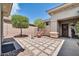 Cozy patio area featuring decorative stone tiles and a seating area at 41229 N Belfair Way, Anthem, AZ 85086