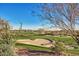 Scenic view of the golf course with sand traps, desert landscape, and beautiful mountain views at 41906 N Crooked Stick Rd, Anthem, AZ 85086