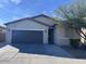 Attractive one-story home with desert landscaping and a two-car garage at 4250 N 87Th Ln, Phoenix, AZ 85037