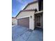 Spacious two car garage with an easy entry access door at 4250 N 87Th Ln, Phoenix, AZ 85037