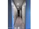 Hallway with neutral paint and tile flooring at 4250 N 87Th Ln, Phoenix, AZ 85037