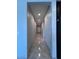 Long hallway with recessed lighting and tile floors at 4250 N 87Th Ln, Phoenix, AZ 85037