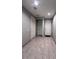 Hallway with neutral paint and tile flooring at 4250 N 87Th Ln, Phoenix, AZ 85037