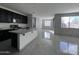 Open-concept kitchen with modern appliances and an island at 4250 N 87Th Ln, Phoenix, AZ 85037
