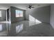 Modern living room featuring tile floors and a window at 4250 N 87Th Ln, Phoenix, AZ 85037