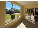 Bright sun room with backyard views and sliding doors at 4665 E Aire Libre Ave, Phoenix, AZ 85032