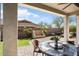 Comfortable outdoor living area with covered patio and water feature in landscaped backyard at 4683 N 206Th Ln, Buckeye, AZ 85396