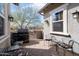 Back patio with BBQ, seating, and view of the neighborhood at 4683 N 206Th Ln, Buckeye, AZ 85396