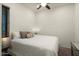Cozy bedroom featuring neutral colors, ceiling fan, and comfortable carpet at 4683 N 206Th Ln, Buckeye, AZ 85396