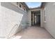 Inviting courtyard with seating area leading to the front entrance at 4683 N 206Th Ln, Buckeye, AZ 85396