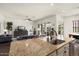 Large kitchen island with granite countertops and stainless steel appliances offer ample workspace at 4683 N 206Th Ln, Buckeye, AZ 85396