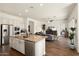 Open concept floor plan showcasing the kitchen and living room, ideal for modern living at 4683 N 206Th Ln, Buckeye, AZ 85396