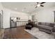 Bright kitchen and open living area with wood-look floors and lots of natural light at 4683 N 206Th Ln, Buckeye, AZ 85396