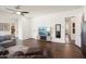 Spacious living room featuring wood-look flooring and neutral decor at 4683 N 206Th Ln, Buckeye, AZ 85396