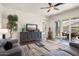 Bright living area featuring a sliding glass door leading to an outdoor patio space at 4683 N 206Th Ln, Buckeye, AZ 85396