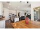 Open concept living space with kitchen island, stainless appliances, and adjacent Gathering room at 4683 N 206Th Ln, Buckeye, AZ 85396