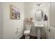 Powder room featuring modern fixtures, wood flooring, and decorative accents at 4683 N 206Th Ln, Buckeye, AZ 85396