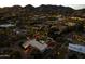 Desert estate with a sparkling pool and mountain views, beautifully lit at twilight at 4726 E Sierra Vista Dr, Paradise Valley, AZ 85253
