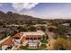 Expansive aerial view of a home with a pool, lounge chairs, and picturesque mountain views, creating an idyllic retreat at 4726 E Sierra Vista Dr, Paradise Valley, AZ 85253