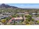 Beautiful aerial view of a home with a pool, desert landscaping, and breathtaking mountain views in the background at 4726 E Sierra Vista Dr, Paradise Valley, AZ 85253