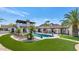Lush backyard with a sparkling pool, lounge seating, and well-manicured turf at 4726 E Sierra Vista Dr, Paradise Valley, AZ 85253