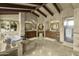 Spacious bathroom featuring dual vanities, walk-in shower, travertine tile, and a standalone tub with backyard views at 4726 E Sierra Vista Dr, Paradise Valley, AZ 85253