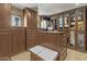 Walk-in closet with custom built-in cabinets, drawers, a center island, and ample storage space at 4726 E Sierra Vista Dr, Paradise Valley, AZ 85253