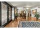 Formal dining room showcasing elegant iron door, tile floors, and dining set with art on walls at 4726 E Sierra Vista Dr, Paradise Valley, AZ 85253