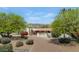 Charming home with a circular driveway, lush landscaping, and a welcoming front entrance showcasing curb appeal at 4726 E Sierra Vista Dr, Paradise Valley, AZ 85253