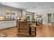 An open kitchen features a central island and an adjacent dining area with vintage wooden furnishings at 4726 E Sierra Vista Dr, Paradise Valley, AZ 85253