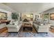 Spacious living room features a stone fireplace and comfortable seating, creating an inviting atmosphere at 4726 E Sierra Vista Dr, Paradise Valley, AZ 85253