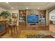 Living room includes a built-in entertainment center, a full bar, wood flooring, and comfortable seating at 4726 E Sierra Vista Dr, Paradise Valley, AZ 85253