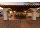 Charming covered outdoor dining area with ample seating and a built-in grill, perfect for entertaining and enjoying alfresco meals at 4726 E Sierra Vista Dr, Paradise Valley, AZ 85253