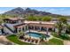 Aerial view of a stunning backyard pool area with lounge chairs and mountain views at 4726 E Sierra Vista Dr, Paradise Valley, AZ 85253