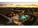 Inviting pool with lounge chairs and a covered patio, set against a sunset backdrop at 4726 E Sierra Vista Dr, Paradise Valley, AZ 85253